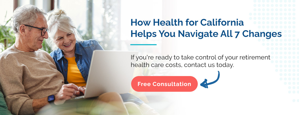 An elderly couple review health insurance options on a laptop