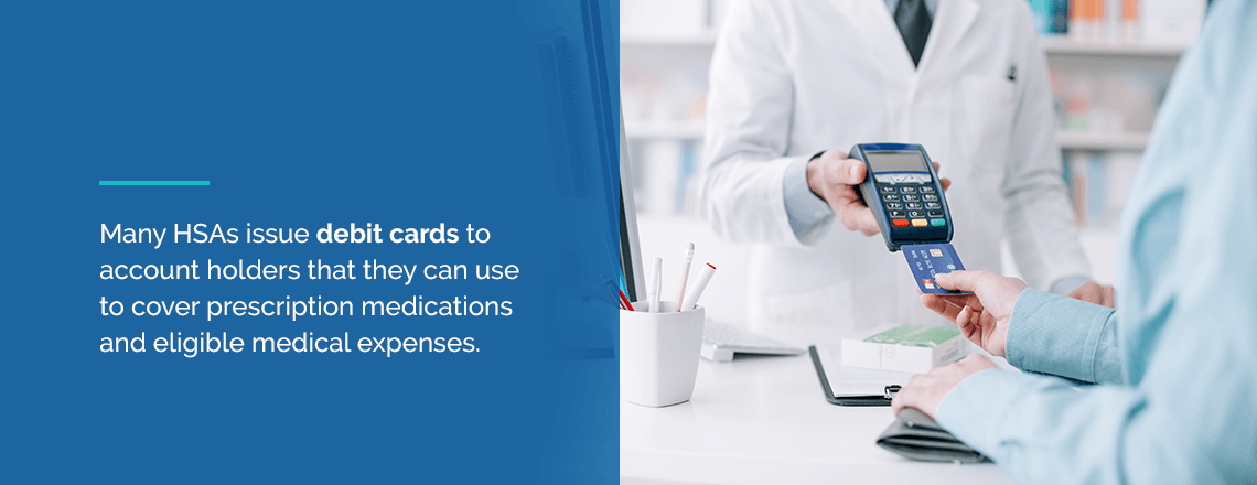 person using credit card to pay for prescription medications